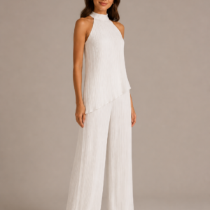 A Ivory pleated co-ord set featuring an asymmetric top with layered detailing, paired with flowy wide leg trousers.